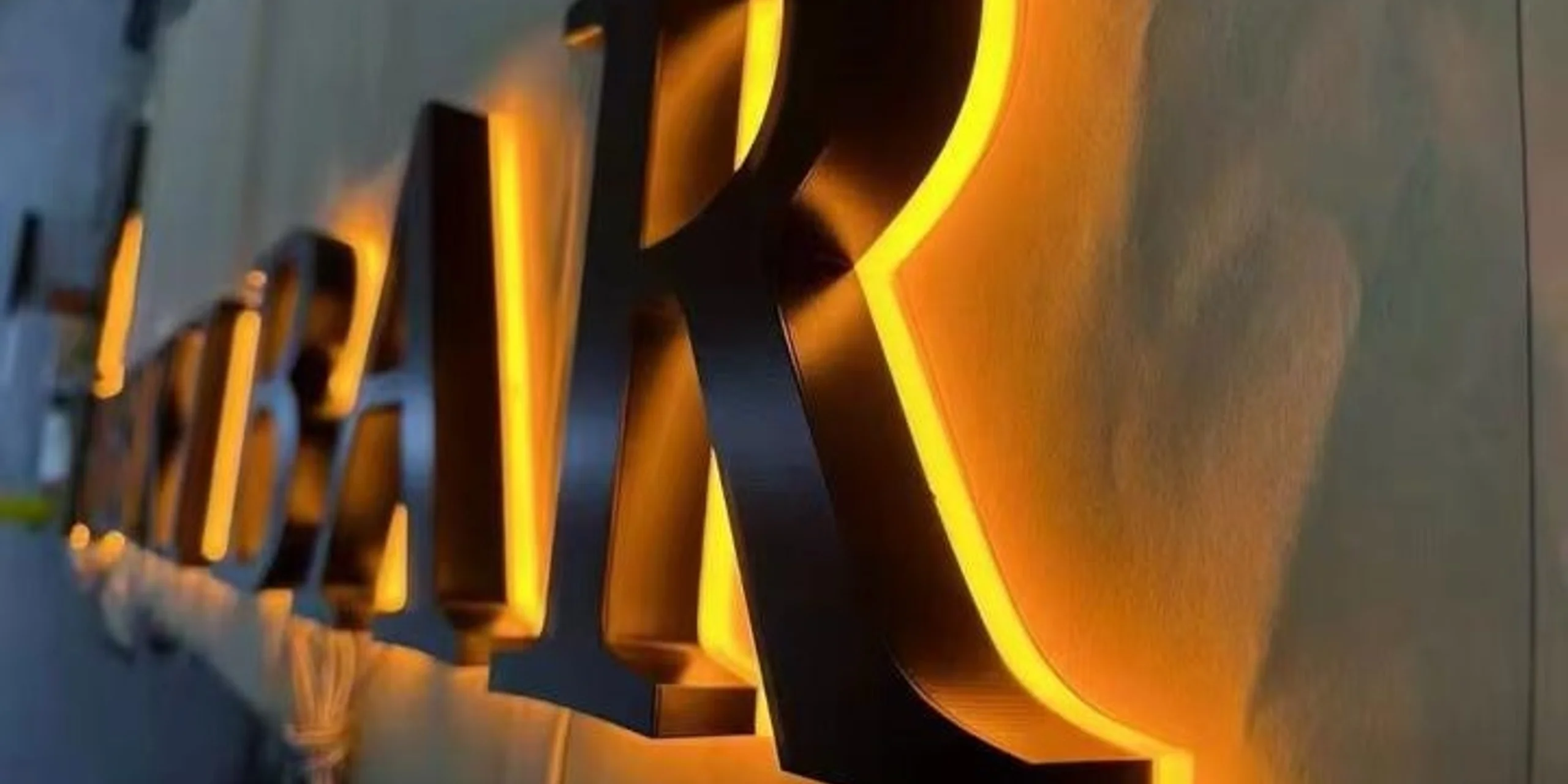 Factory workshop with backlit signs in production