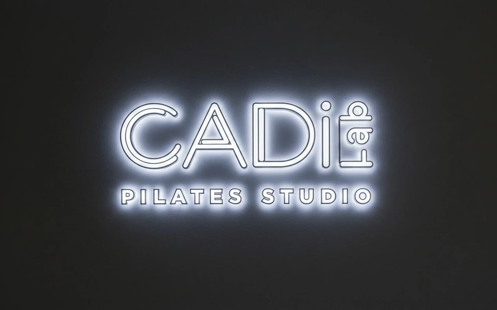 Backlit sign mockup for CADiLab Pilates