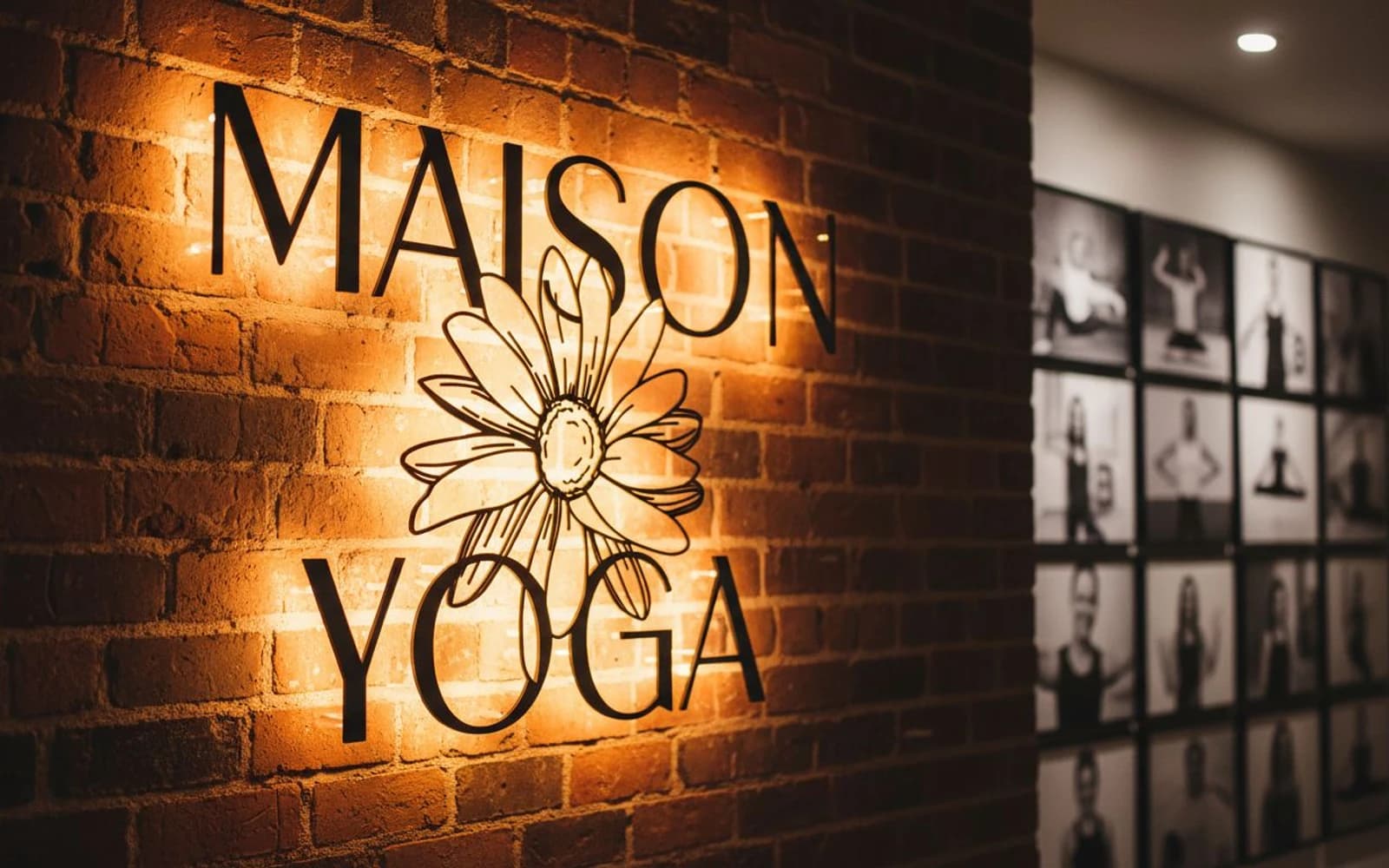 Warm backlit wordmark with flower on brick wall
