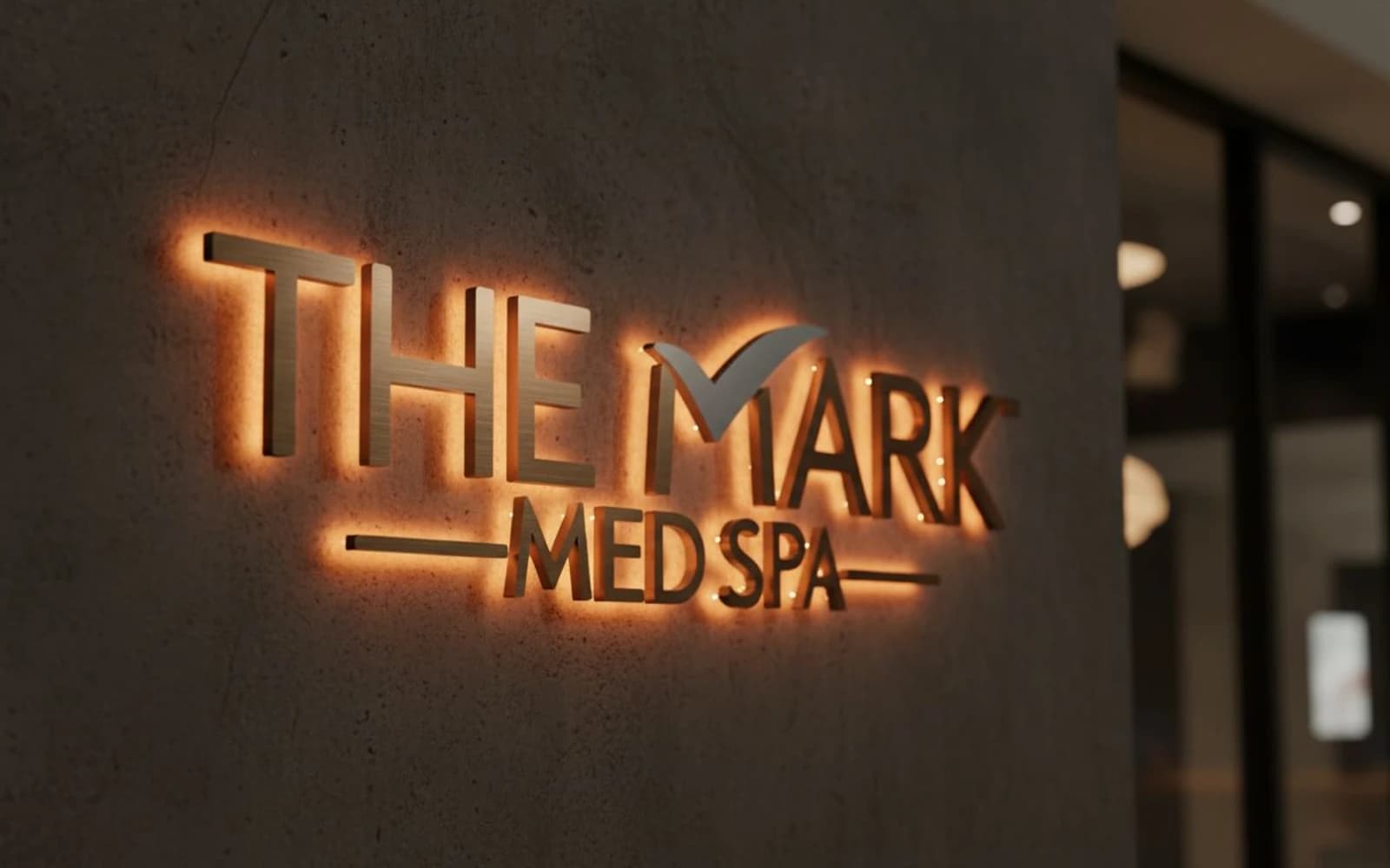 Backlit sign mockup for The Mark Med Spa